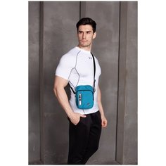 Сумка на плечо Umbro Paton Pi Bag с внутренним карманом- органайзером. Удобная сумка из полиэстера через плечо Umbro со светоотражающей деталью, синий, 2 литра, 21.5 х 5.5 х 15 см