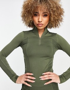 Темно-зеленый бесшовный топ с молнией длиной 1/4 Puma Training Evoknit-Зеленый цвет