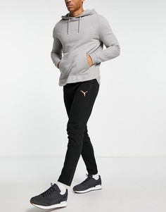 Черные джоггеры с золотистым принтом пантеры Puma Evostripe-Черный цвет