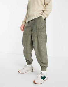 Суженные книзу вельветовые брюки цвета хаки в стиле oversized в крупный рубчик ASOS DESIGN-Зеленый цвет