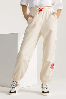 Спортивные брюки женские Anta CHINESE NEW YEAR 862318316 бежевые L