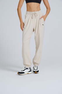 Спортивные брюки женские Anta Dance Ecocozy/ANTIBACTERIAL 862338320 бежевые XS