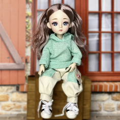 Кукла шарнирная в зеленом свитере интерьерная 30см No Brand