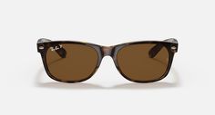 Солнцезащитные очки унисекс Ray-Ban RB2132 коричневые1