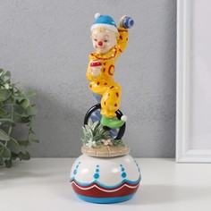 Сувенир музыкальный Клоун жонглирует сидя на колесе 8,5х8,5х22 см No Brand
