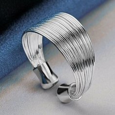 Кольцо плетеное, серебряный Reniva